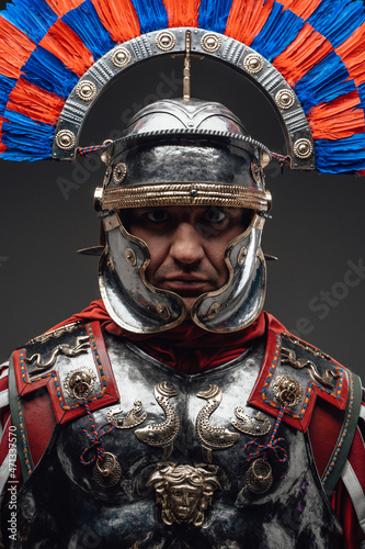 Fototapeta Roman centurion with plumed helmet staring at camera