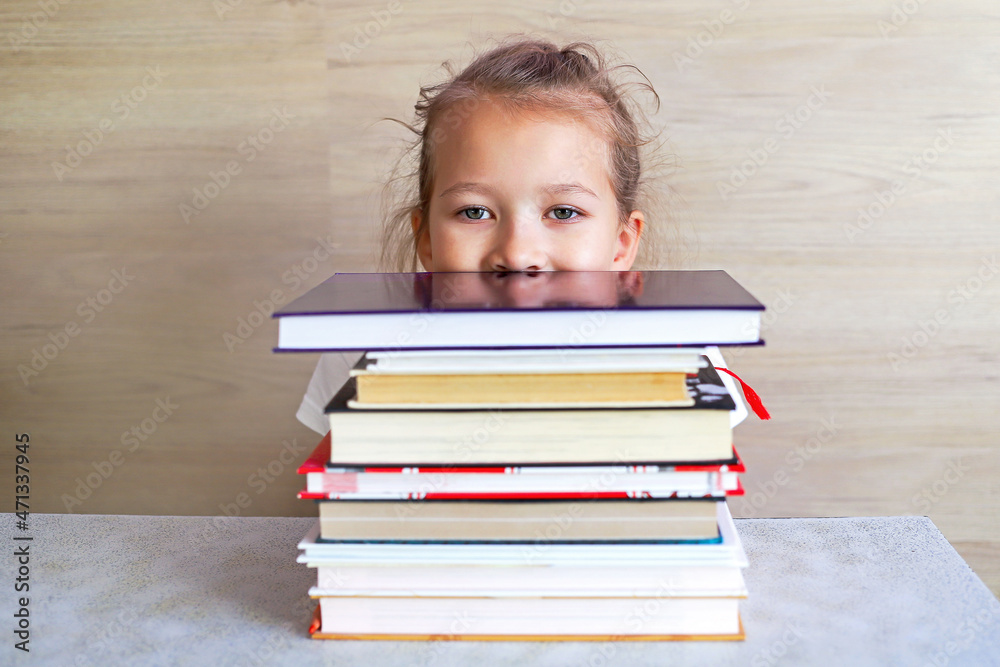 Schoolgirl girl reads books after school to know a lot Schoolgirl girl reads books after school to know a lot