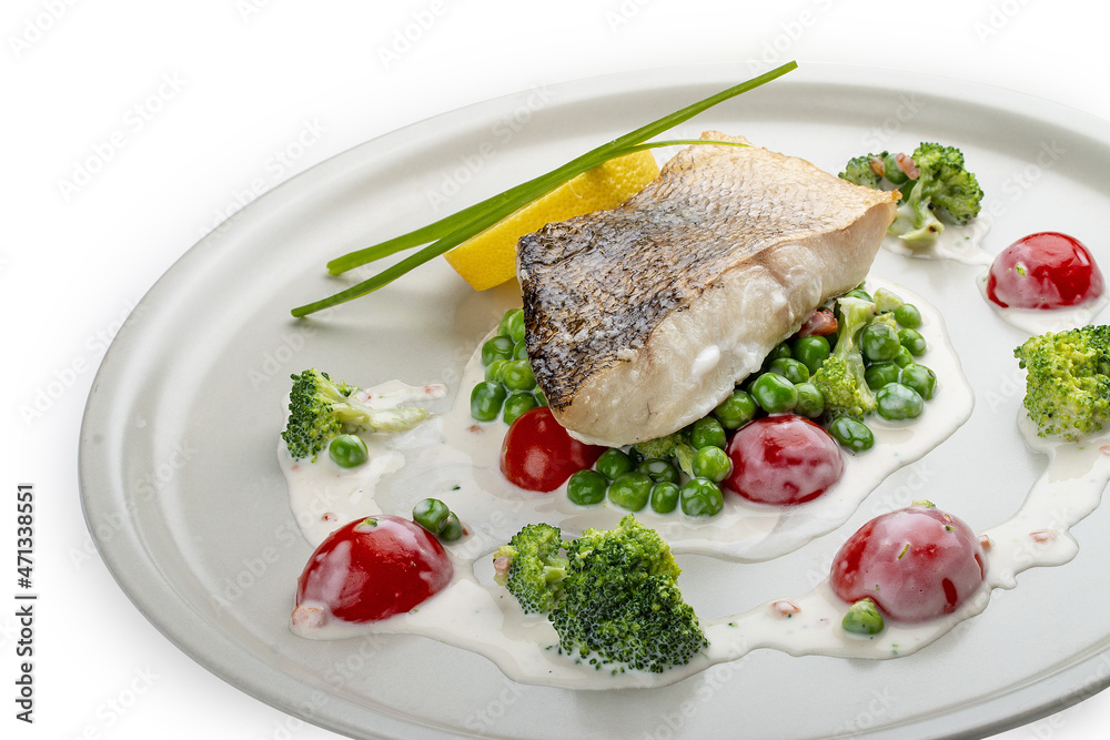Pike perch on a vegetable pillow . Isolated on a white background.