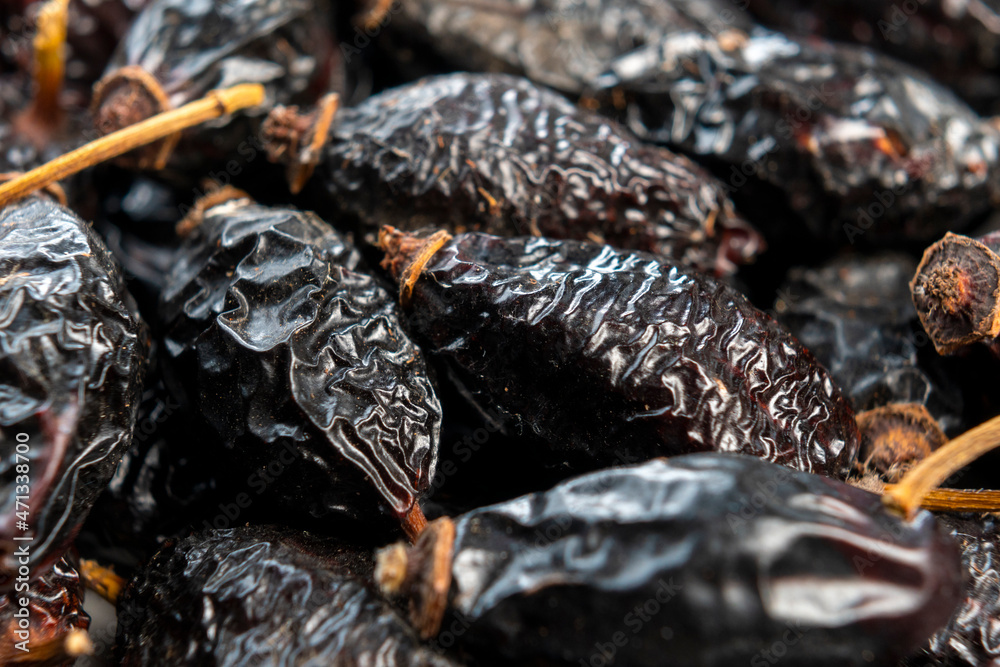 Dry rose hips. Dried wrinkled briar berries. Dog-rose fruits. Macro Dry rose hips. Dried wrinkled briar berries. Dog-rose fruits. Macro