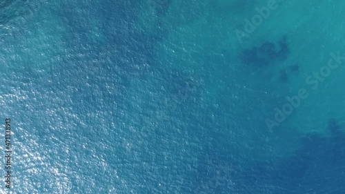 Aerial top down view from high altitude of blue azure turquoise sea water texture. a view of the water surface. Background of the water surface. 4k