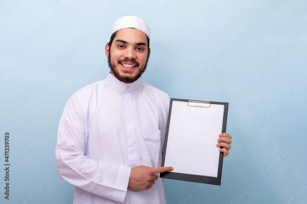 Arabian muslim man with beard and traditional outfit. Arabian muslim man with beard and traditional outfit.