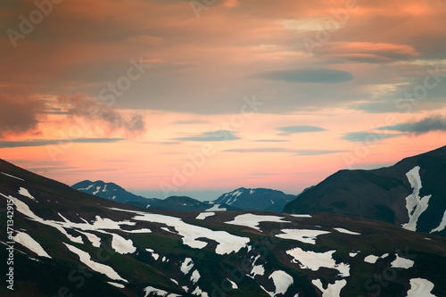 Mountains with clouds at sunset on Vilyuchinsky pass in Kamchatka peninsula, Russia. Beautiful summer landscape photo