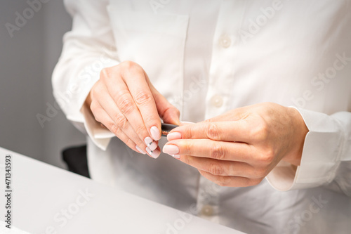 Professional manicurist preparing tools for doing clients nails