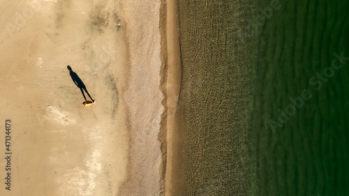 aerial view of the man standing on the beach