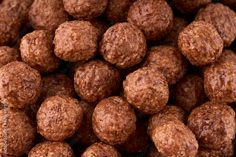 Variety of cold cereals, quick breakfast for kids overhead shot. Quick breakfast. Chocolate balls isolated on a white background. Rings isolated on a white background. Variety of cold cereals, quick breakfast for kids overhead shot. Quick breakfast. Chocolate balls isolated on a white background. Rings isolated on a white background.