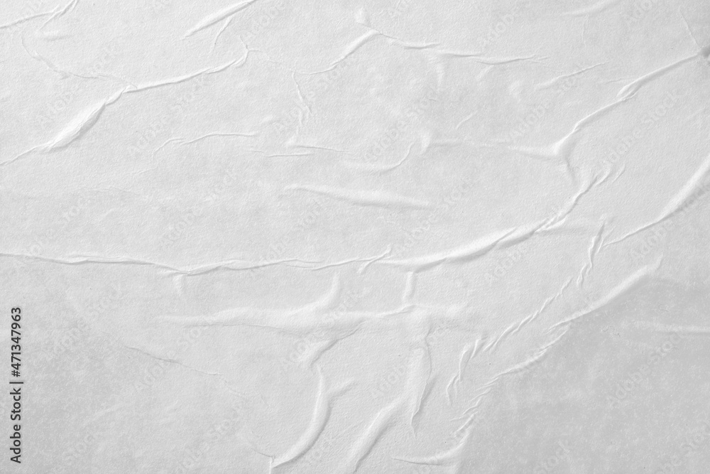 Abstract background of white crumpled paper. The texture of the paper. Abstract background of white crumpled paper. The texture of the paper.