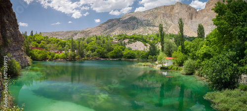 Small and beautiful turquoise lake. The lake between the mountains.