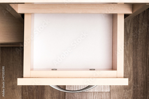 Empty open pull-out furniture drawer, top view