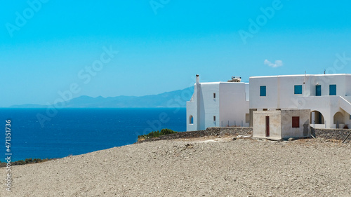 Traditional aegean greek island buildings, houses of greece islands, white walls, blue windows and doors, travelling concept