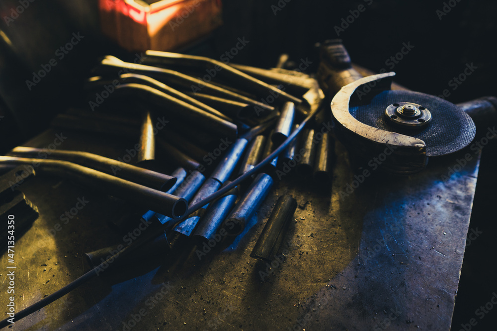 Steel pipe accessories manufacturing. Steel pipe in stacks.