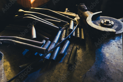 Steel pipe accessories manufacturing. Steel pipe in stacks.