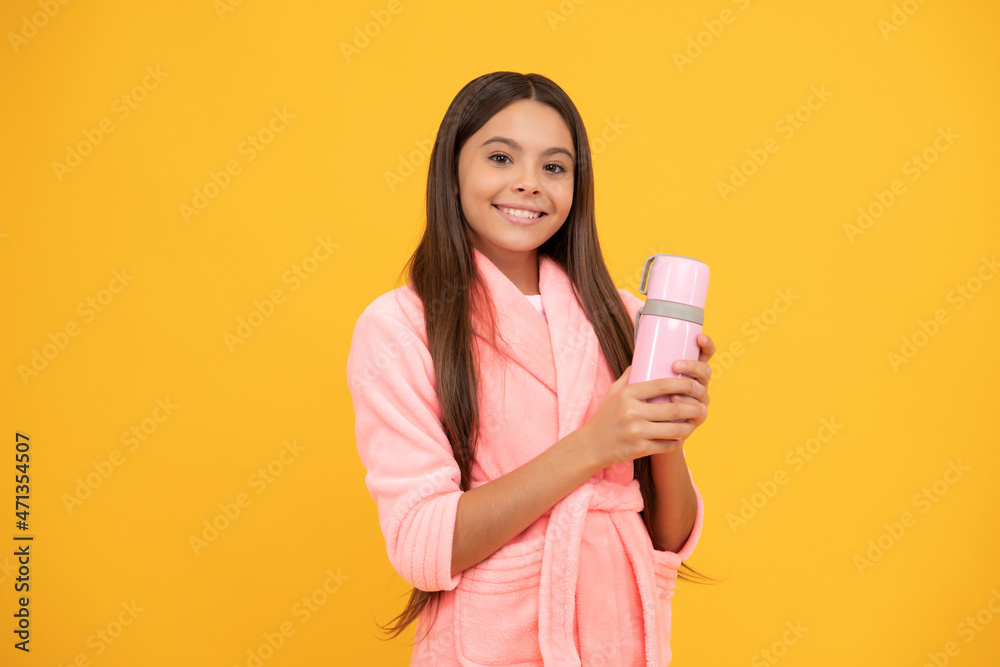 happy teen girl in home terry bathrobe with thermos bottle, morning happy teen girl in home terry bathrobe with thermos bottle, morning