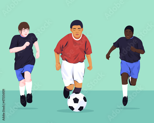 Diverse boys playing football league match