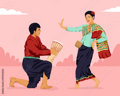 Man playing drum and woman dancing at traditional asian festival