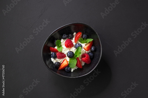 Fresh cottage cheese , ricotta and berries for healthy eating photo