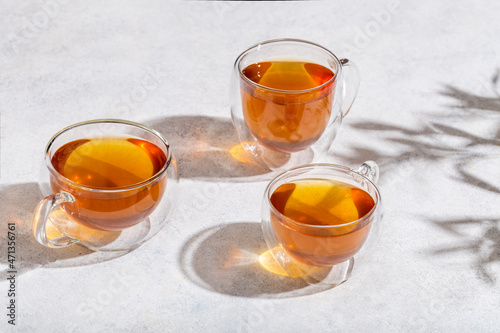 glass cups of tea on lightn table