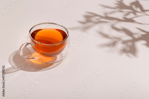 glass cups of tea on lightn table photo