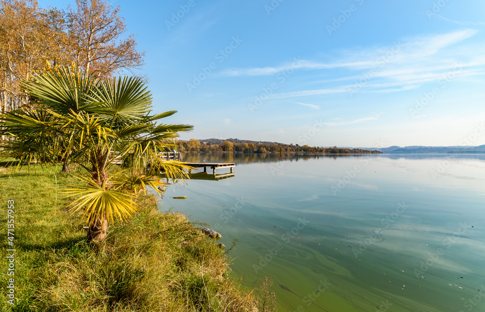 Autumn landscape of Lake Varese with Lakeside promenade in Gavirate, province of Varese, Italy