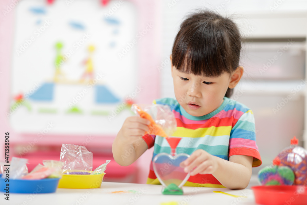 young girl making sand crafts for homeschooling young girl making sand crafts for homeschooling
