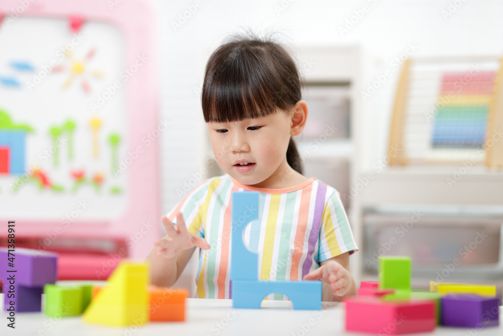 young girl playing creative blocks at home young girl playing creative blocks at home