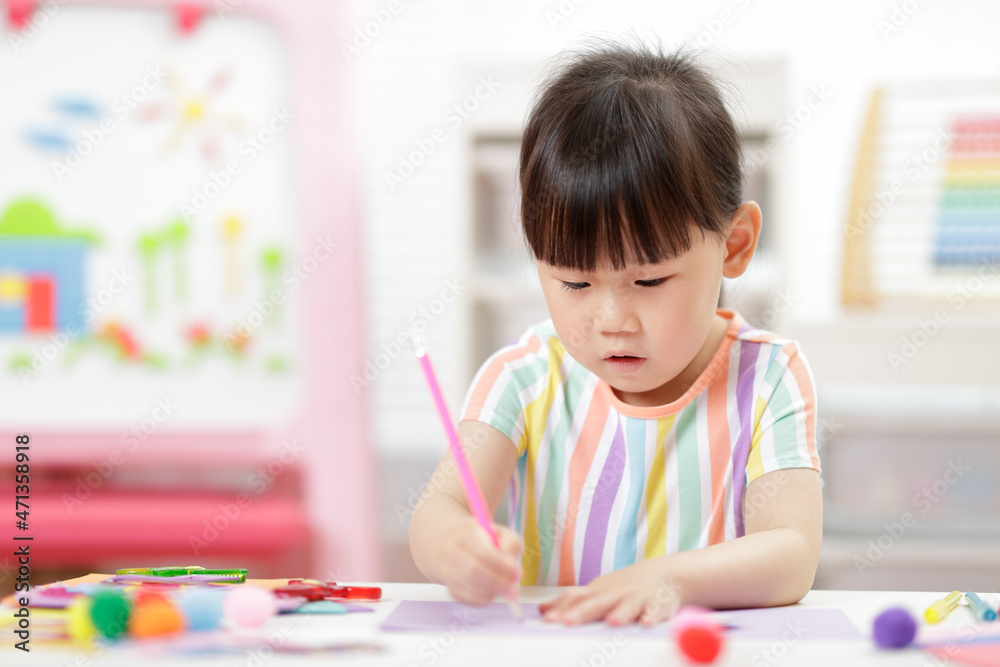 young girl making paper craft for homeschooling young girl making paper craft for homeschooling