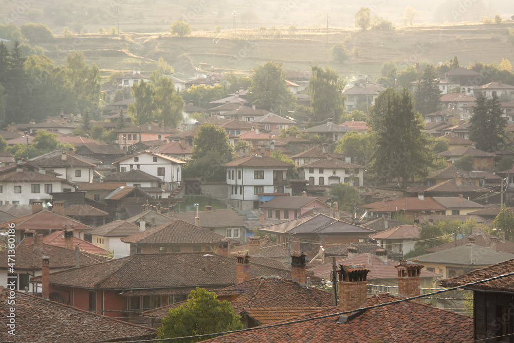 View of the historic town of Koprivshtitsa in evening mist, Bulgaria