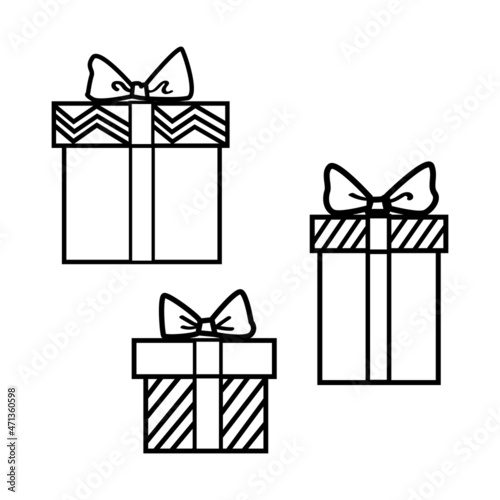 Composition of 3 gift boxes with a bow and a surprise inside in black and white design.