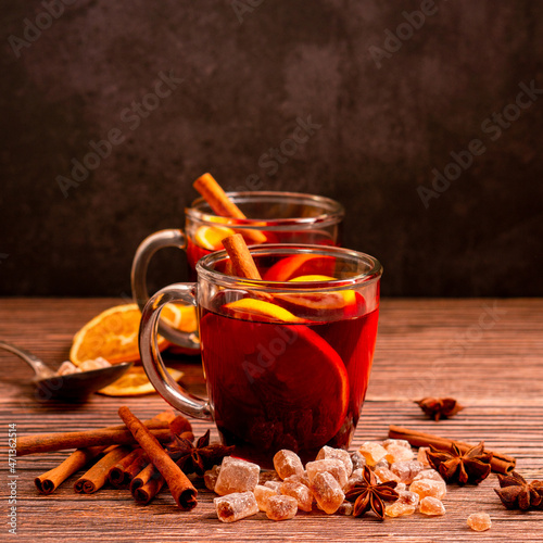 Fototapeta Naklejka Na Ścianę i Meble -  Gluhwein sweet hot warm Mulled red Wine or punch tea in mug cup glass spices citrus aromatic cinnamon star anise German tradition winter Christmas market beverage drink new year holidays festival