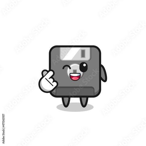 floppy disk character doing Korean finger heart © heriyusuf