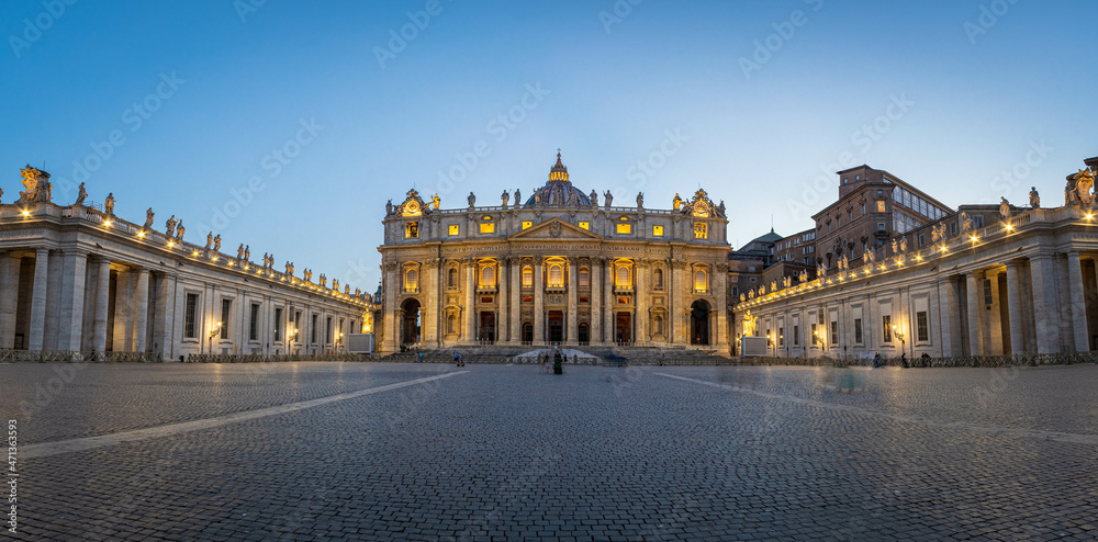 Panorama in Piazza San Pietro, or Saint Peters Square, during the blue hour with a view of the basilica in Vatican City.