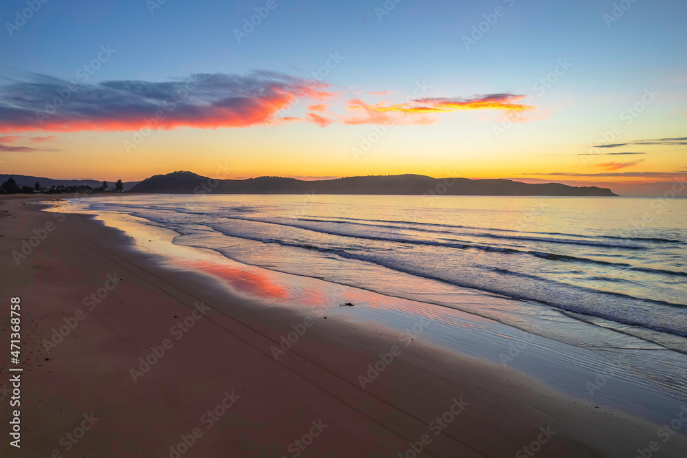 Sunrise seascape with a mix of high and medium clouds
