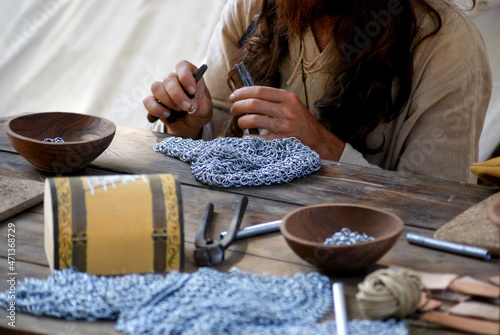 Artisan making steel mesh photo