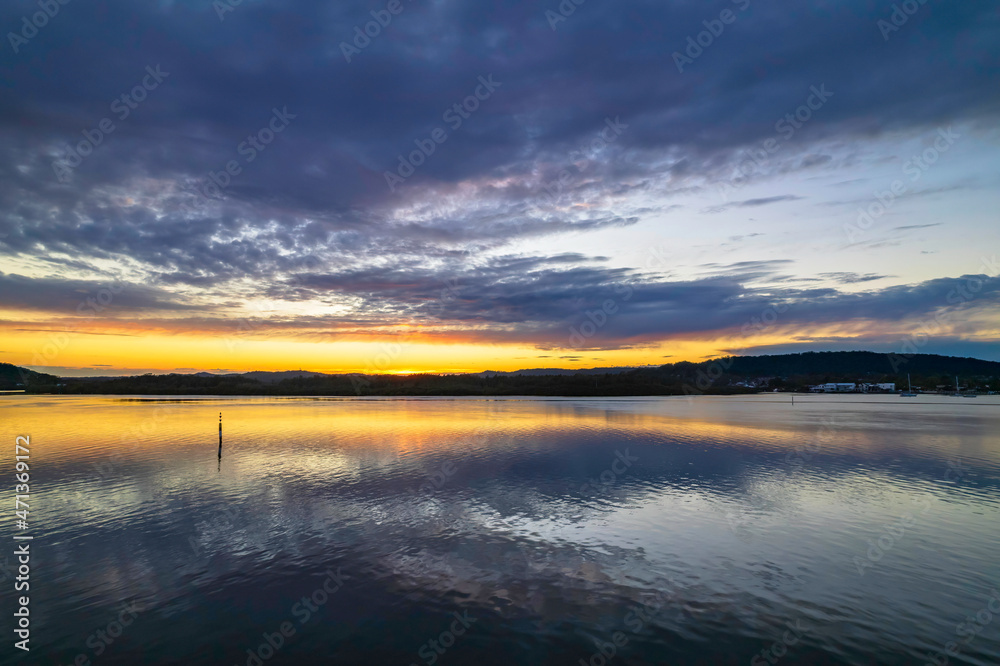 Sunrise aerial waterscape over the bay with cloud cover Sunrise aerial waterscape over the bay with cloud cover