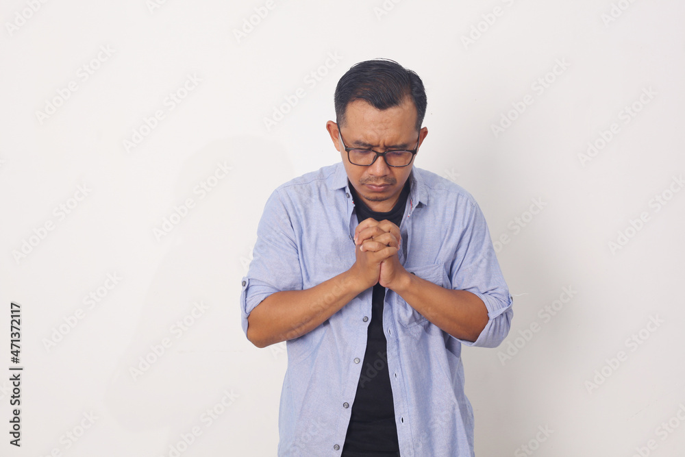 Mature asian Man Praying Standing isolated on white Background Mature asian Man Praying Standing isolated on white Background