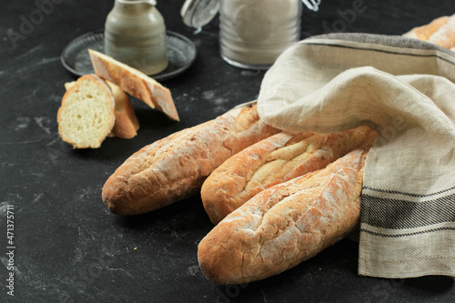 French Baguette Bread on Black Marble Table, Copy Space for Text