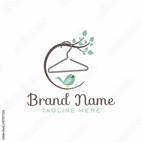 kids clothes store logo with hanger and little bird vector