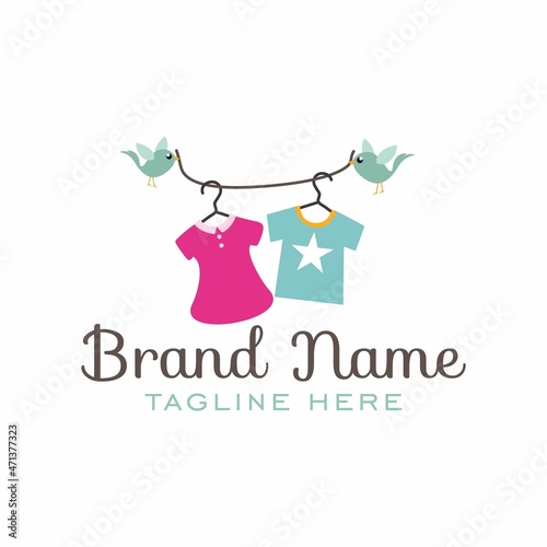 kids clothing store logo hanging on a string by two birds vector