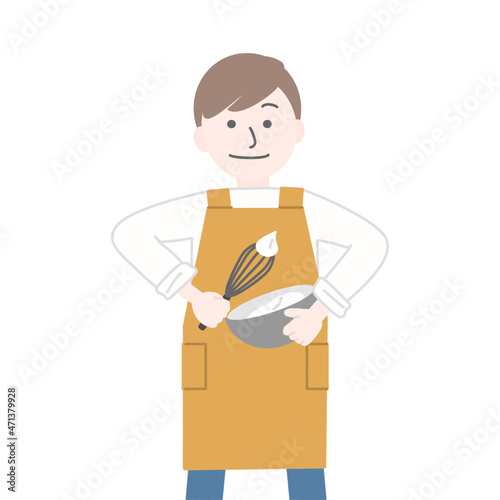 ボウルの中のクリームを泡立てる男性