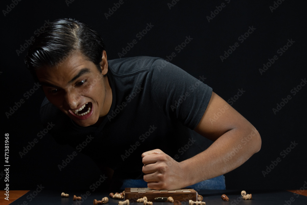 chess player very angry and frustrated about losing the chess game