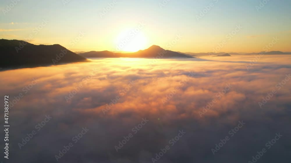 4K Drone flight over the clouds during sunrise. Sun is rising above sea of clouds until the horizon, bright weather and amazing nature landscape
4K Drone flight over the clouds during sunrise. Sun is rising above sea of clouds until the horizon, bright weather and amazing nature landscape