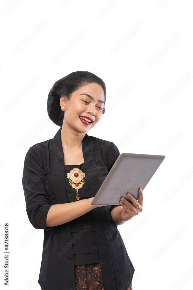 happy asian woman with kebaya using tablet phone happy asian woman with kebaya using tablet phone