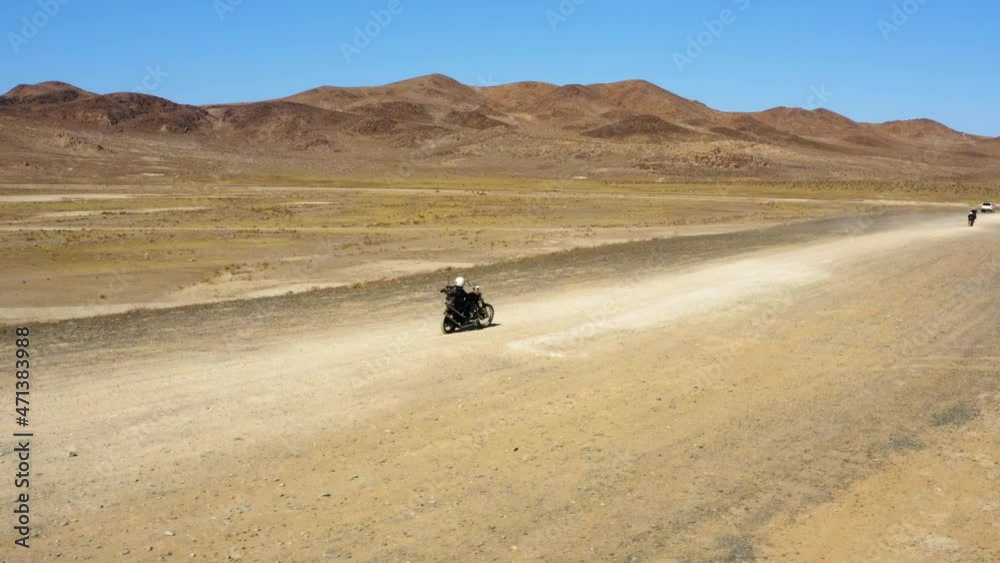 Motorcycle road trip in the desert during a hot sunny clear day Motorcycle road trip in the desert during a hot sunny clear day