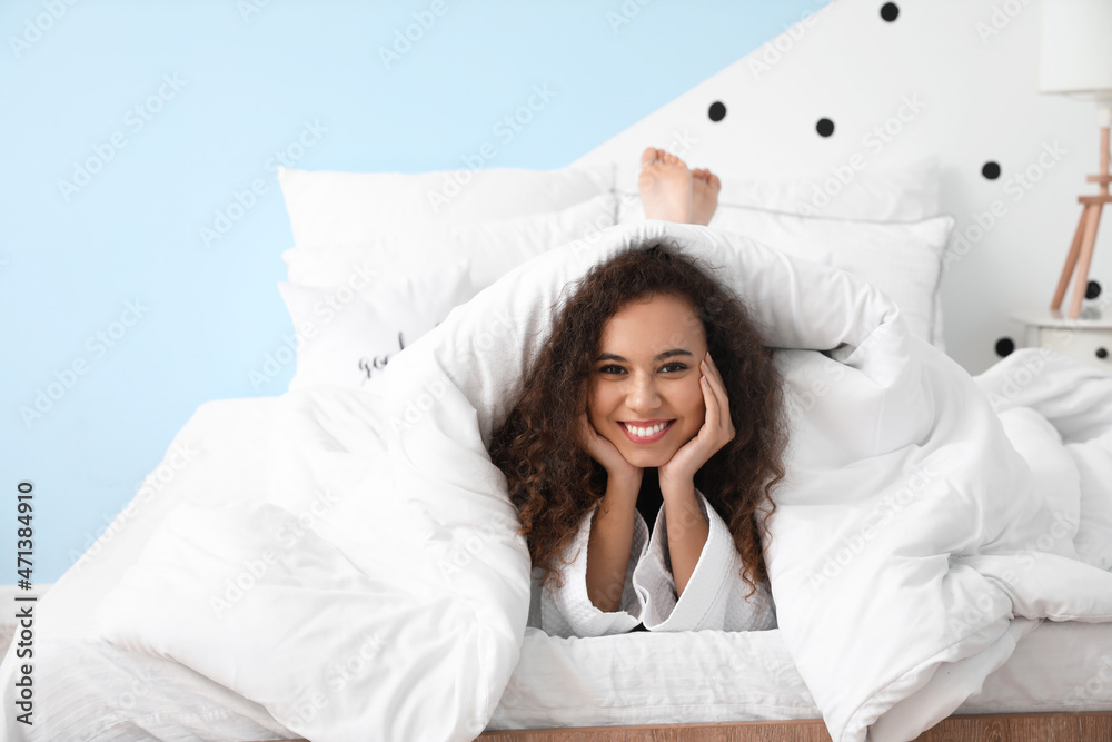 Morning of young woman lying in bed Morning of young woman lying in bed