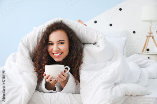 Morning of young woman drin...