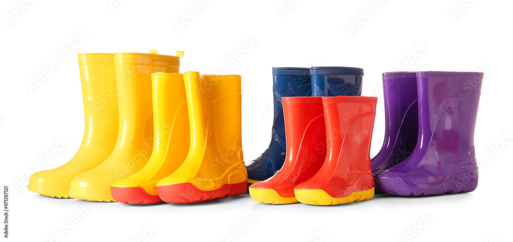 Fototapeta premium Many rubber rain boots isolated on white background