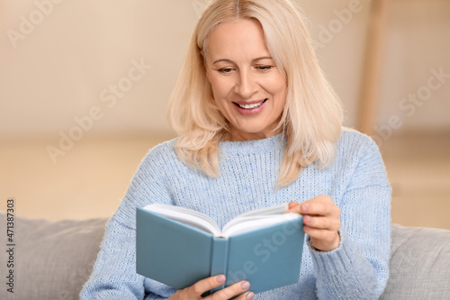 Beautiful mature woman read...