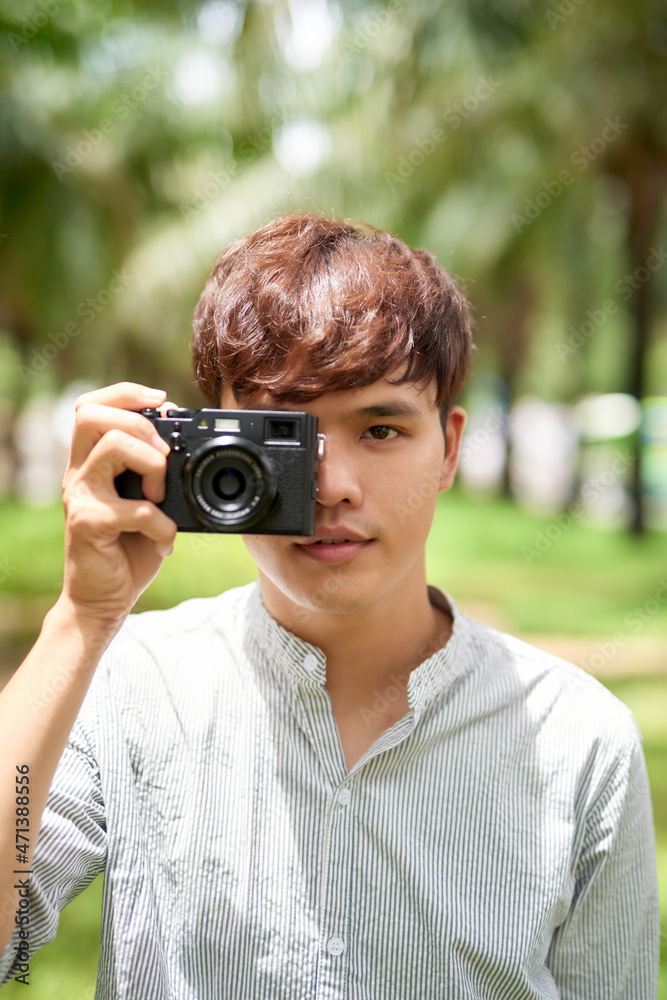 man holding digital camera outdoor man holding digital camera outdoor