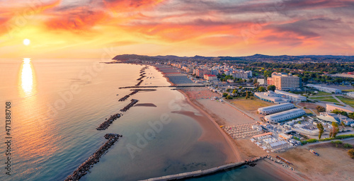 Fototapeta Naklejka Na Ścianę i Meble -  Sunny summer view from flying drone of Cattolica town, Province of Rimini. Fantastic sunrise on east coast of Adriatica sea, Italy, Europe. Vacation concept background..
