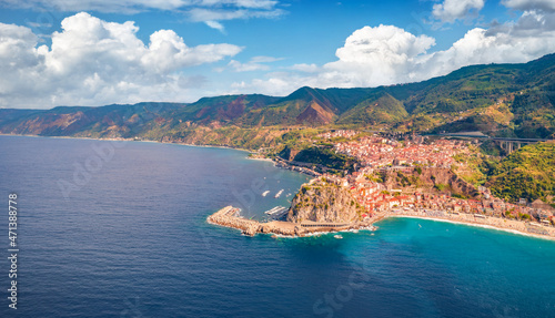Captivating summer view from flying drone of Reggio Calabria, Italy. Attractive summer cityscape of Scilla port. Spectacular morning seascape of Mediterranean sea. Traveling concept background.